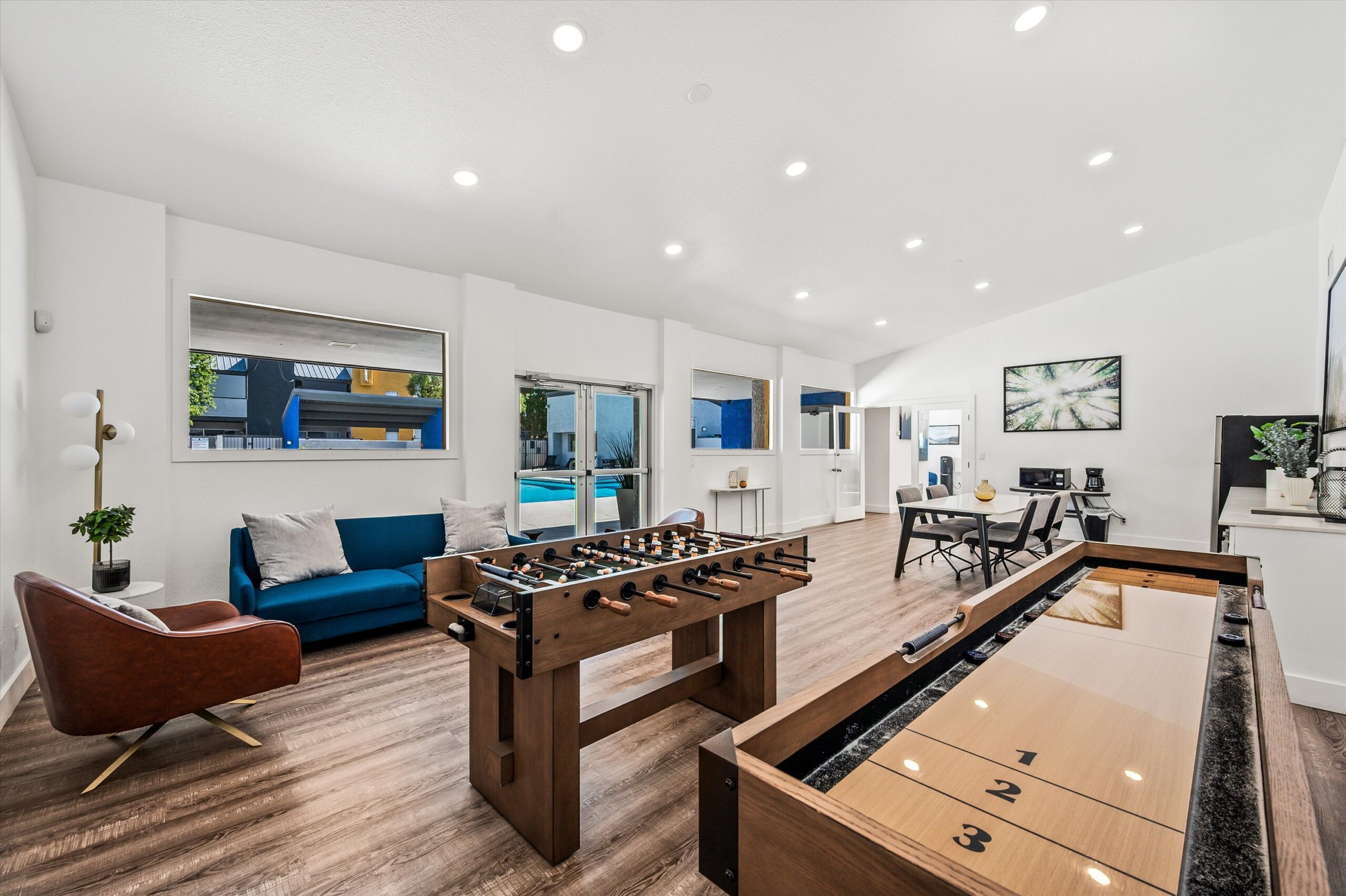 Clubhouse lounge with game tables and seating.